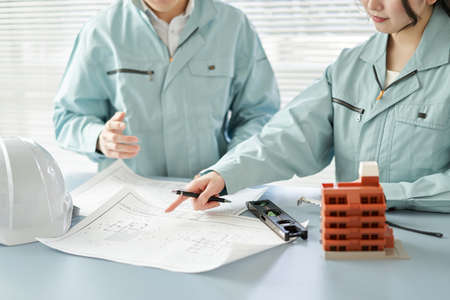 Asian workers having an architectural meeting