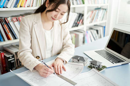 Female architect designing a houseの写真素材