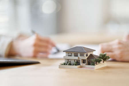 Asian business person having a meeting with the floor plan of real estateの写真素材