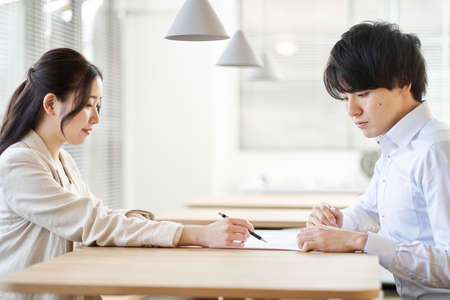 Asian business woman training newcomers