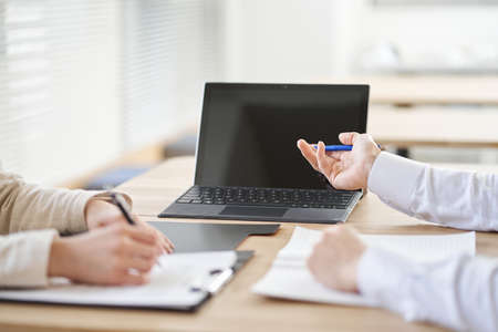 Asian business person having a meeting on a laptopの写真素材