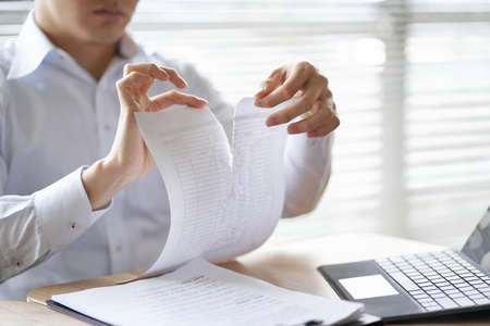 Asian businessman breaking the contract