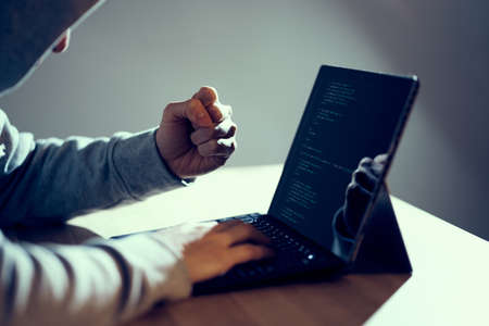 A male hacker who successfully makes a guts pose