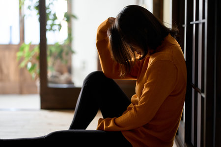 Anxious and depressed Asian womanの写真素材