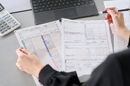 Asian woman preparing tax return documentsの写真素材
