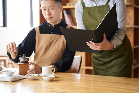 Asian restaurant managers conducting trainingの写真素材
