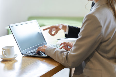 Business woman learning work from seniorsの写真素材