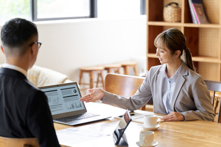 A business woman in a sales position giving an explanationの写真素材