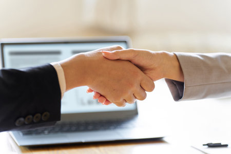 Business people shaking hands at a meetingの写真素材