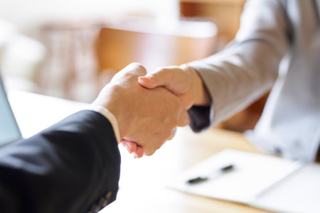 Business people shaking hands at a meetingの写真素材
