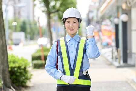 A female security guard doing a fist pumpの写真素材