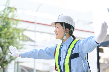 Asian woman working as a security guardの写真素材