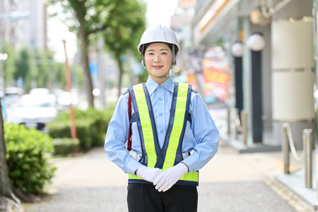 Asian woman working as a security guardの写真素材