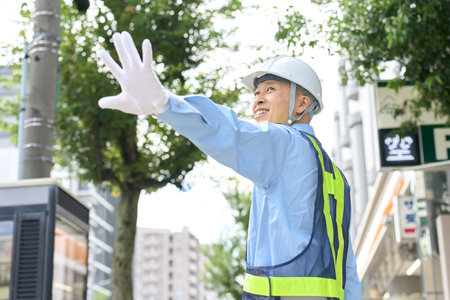 Asian man working as a security guard