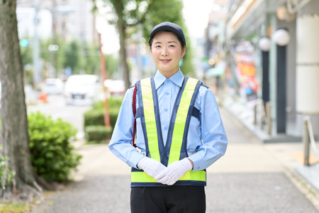 Asian woman working as a security guardの写真素材