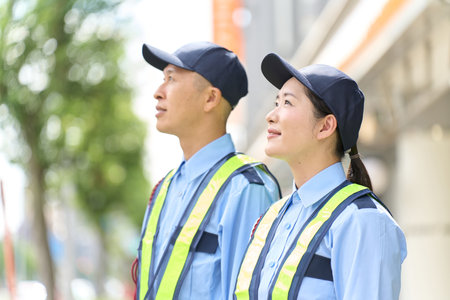 Asian men and women who work as security guards
