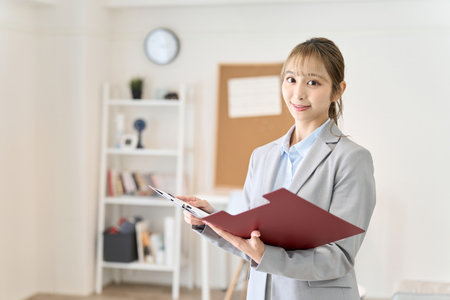 Asian woman checking the roomの写真素材