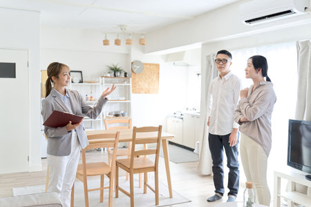 Asian woman guiding the roomの写真素材