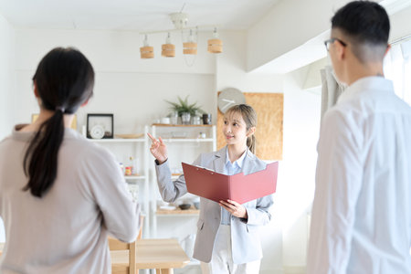 Asian woman guiding the roomの写真素材