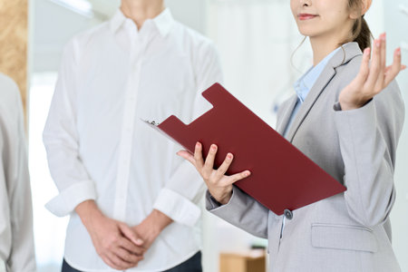 Hands of a business woman inspecting real estateの写真素材