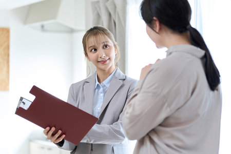 A woman having a meeting about room renovationの写真素材
