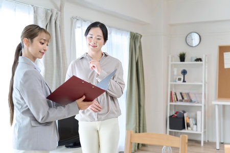A woman having a meeting about room renovationの写真素材