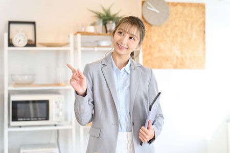Real estate sales staff providing room informationの写真素材