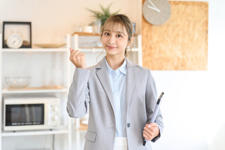 A real estate sales woman doing a fist pumpの写真素材