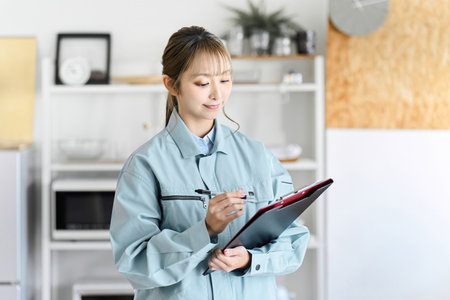 A professional woman comes to your home wearing work clothes to conduct an assessment.