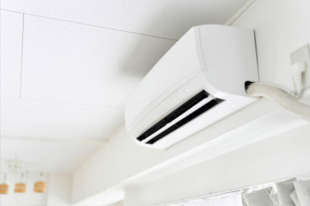 Japanese-made air conditioner working indoorsの写真素材