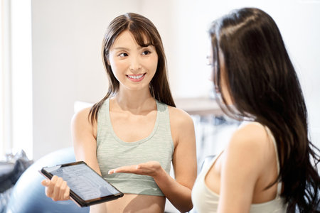 Trainer giving counseling at the gymの写真素材