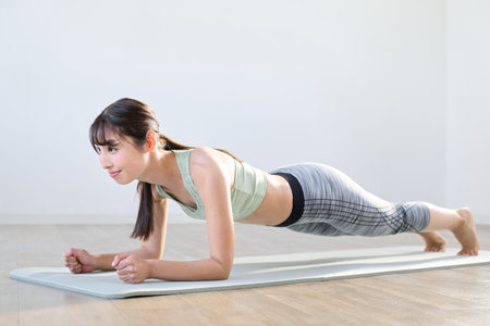 A woman training her core with a plankの写真素材