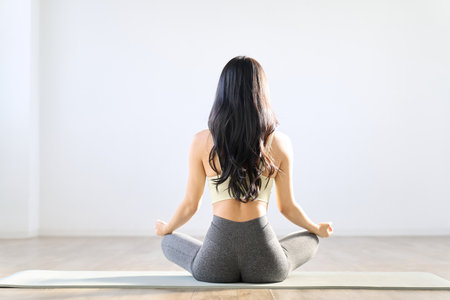 Rear view of a woman meditatingの写真素材