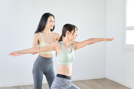 Woman teaching warrior pose 2の写真素材