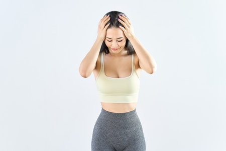 A woman wearing sportswear looking depressedの写真素材
