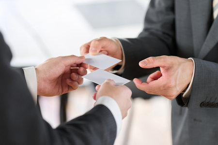 Hands of businessmen exchanging business cardsの写真素材