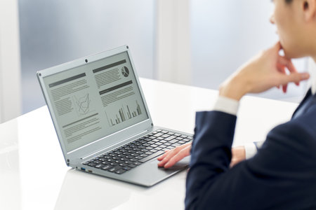 Asian businessman preparing presentation materialsの写真素材