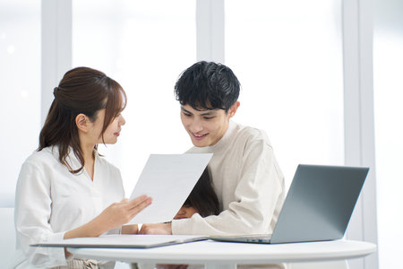 Asian family considering purchasing insuranceの写真素材