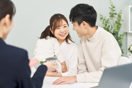 A family receiving real estate informationの写真素材
