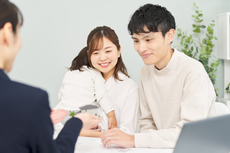 A family receiving real estate informationの写真素材