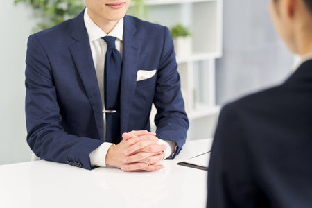 Hands of a businessman having an interviewの写真素材