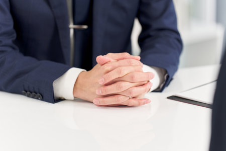 Hands of a businessman having an interviewの写真素材