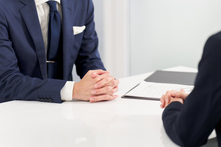 Hands of a businessman having an interviewの写真素材