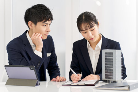 Business people having a meeting about a commercial building