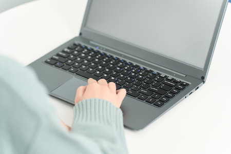 Woman surfing the internet in the living roomの写真素材