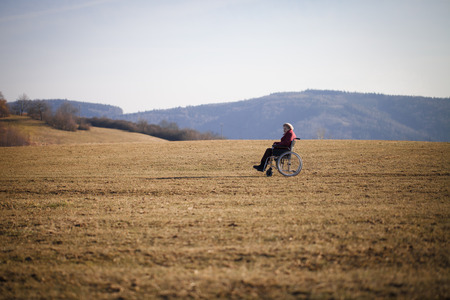 Alone old woman on wheelchairの写真素材