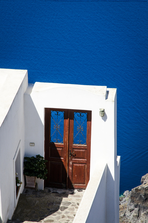 Two doors with nothing behind and overlooking the caldera of Santoriniの写真素材