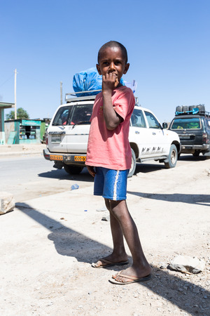 Mekelle, Ethiopia - NOVEMBER 30, 2017: children play with a tire around town.のeditorial素材