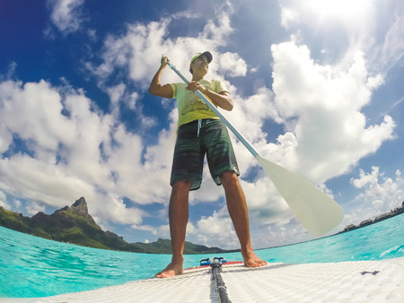 Stand up paddle in Bora Bora Island, French Polynesia.