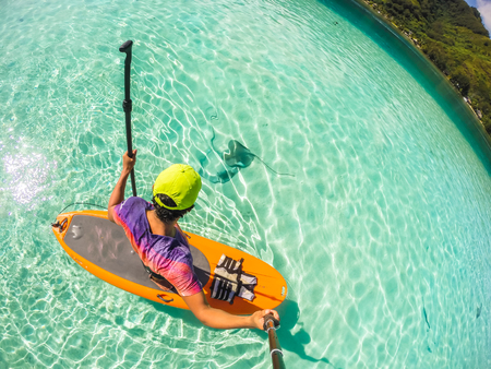 Stand up paddle in Bora Bora Island, French Polynesia.